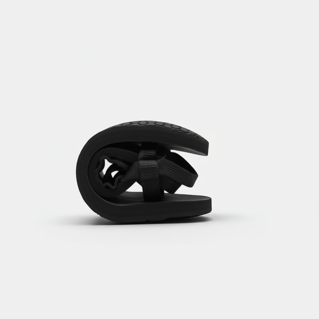 Black folded sandal showing barefoot flexibility