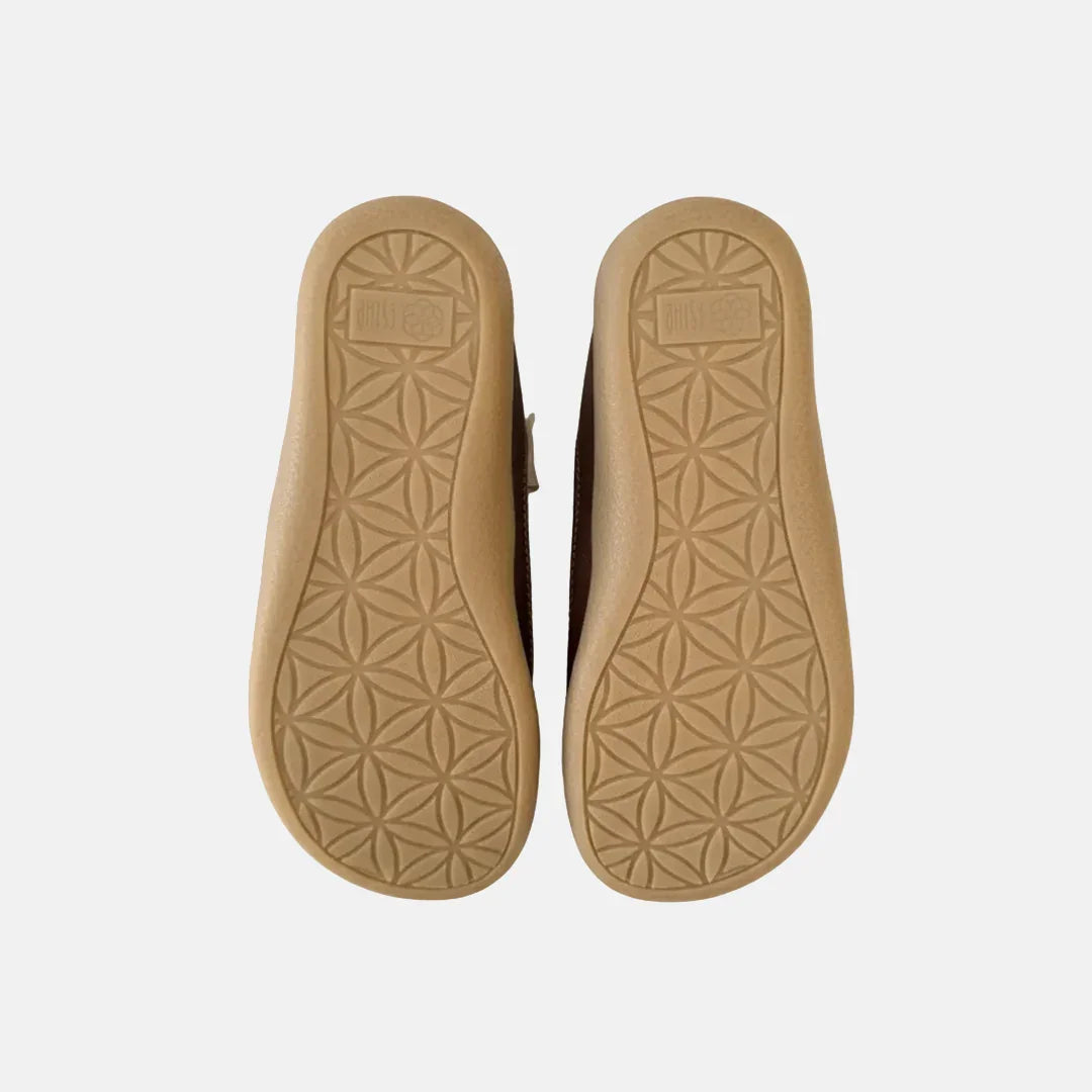 Tan insole with geometric pattern on a white background