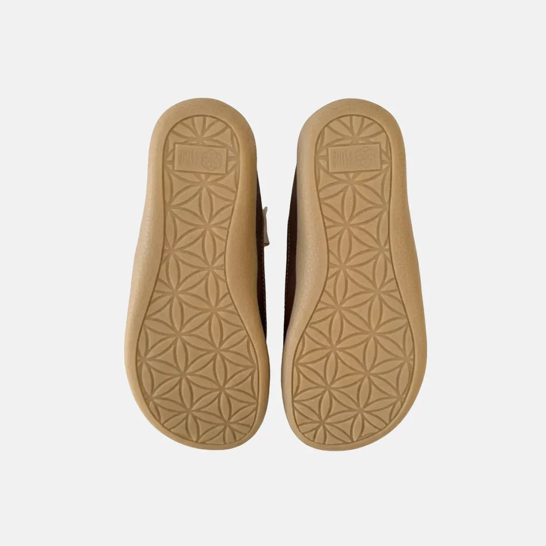 Tan insole with geometric pattern on a white background