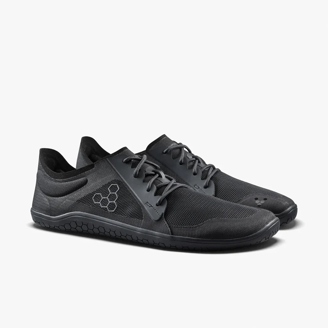 Pair of black athletic shoes on a white background