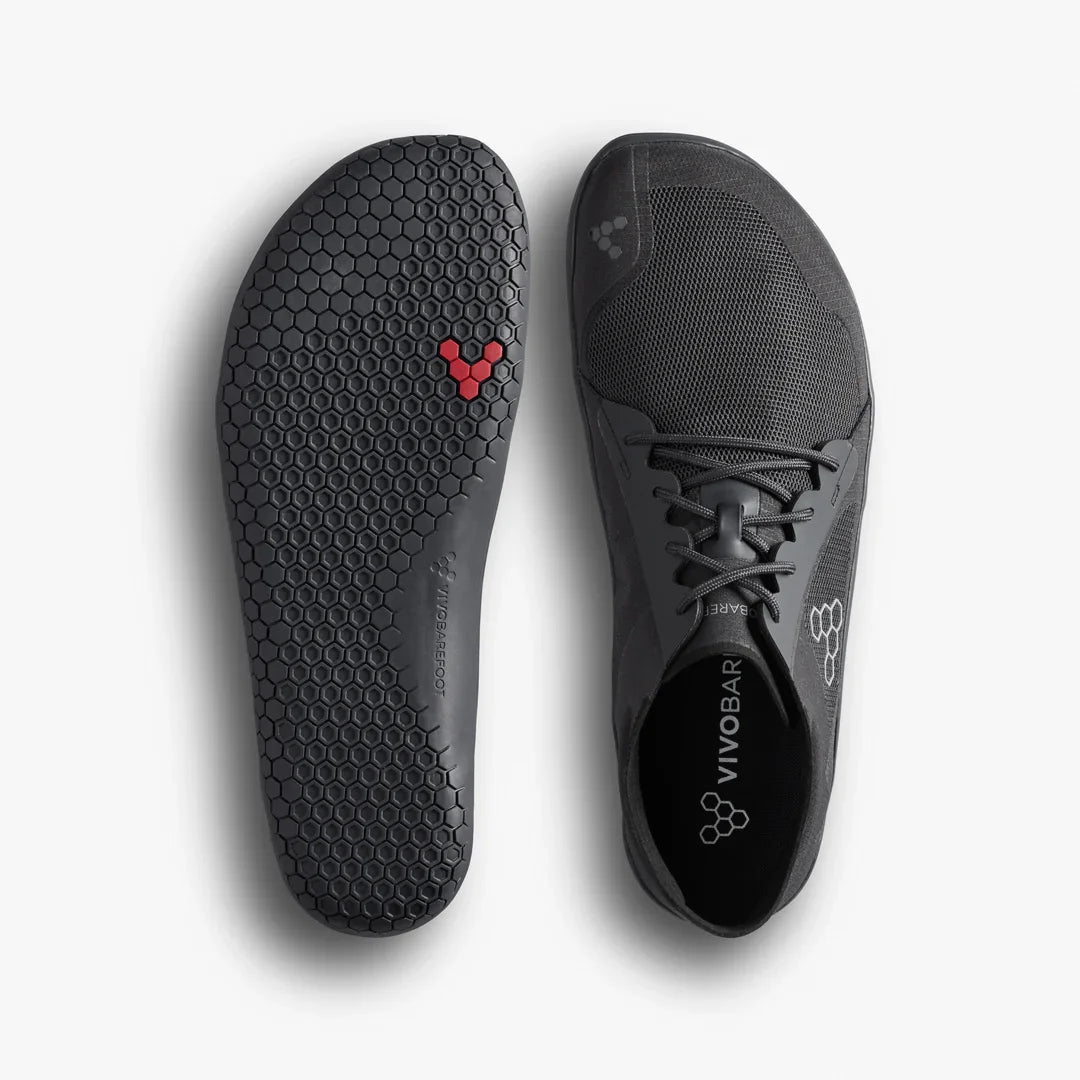 Gray athletic shoe with brand logo on a white background