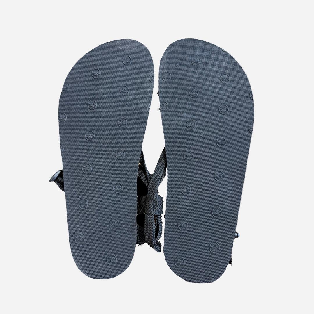 Black sandal sole with a lacing on a white background