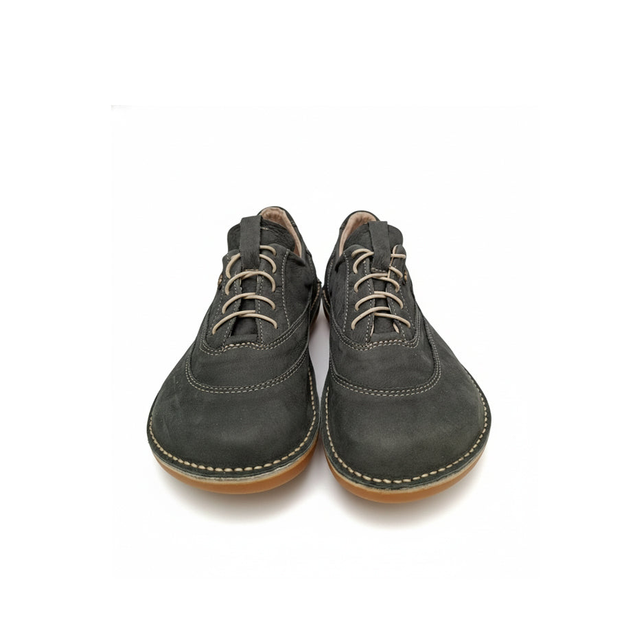 Pair of gray suede shoes on a white background