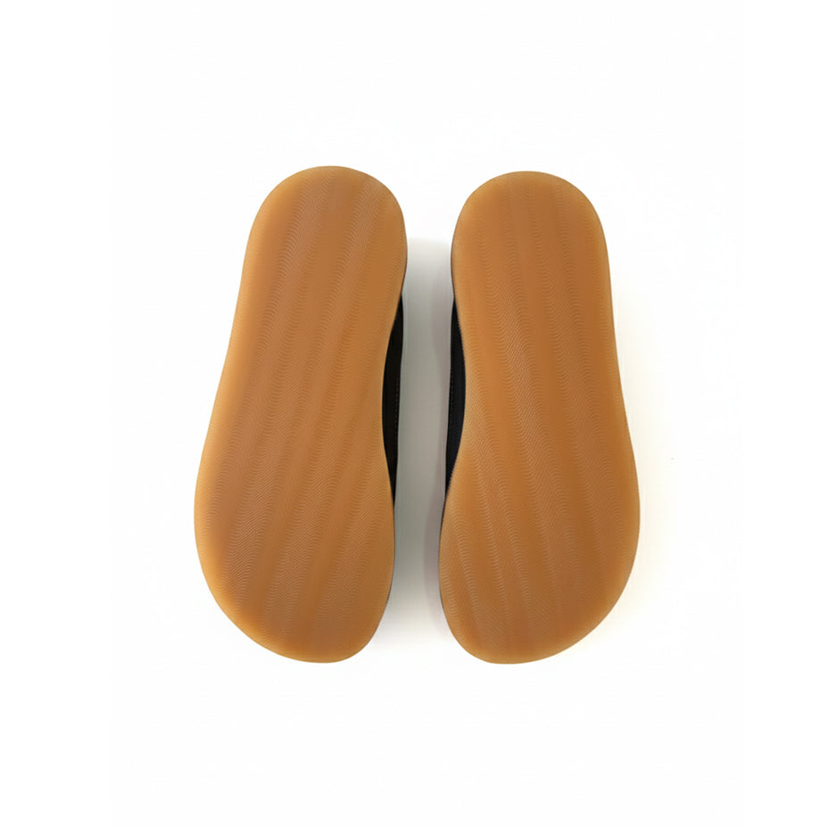 Pair of brown shoe insoles on a white background